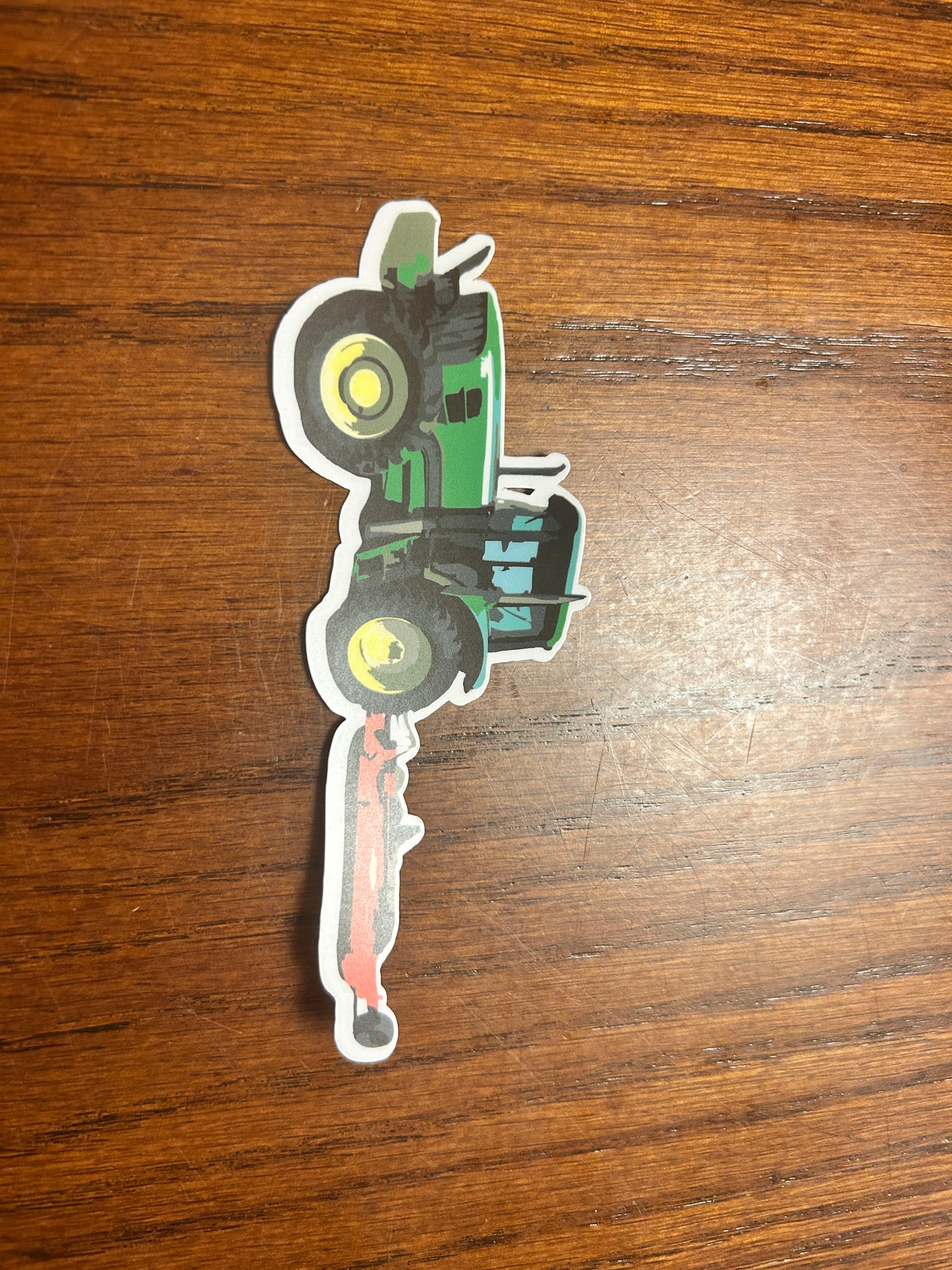 Green Tractor with Red Mower Sticker
